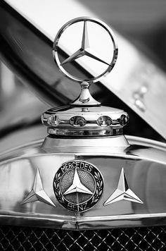 mercedes emblem on the hood of a classic car