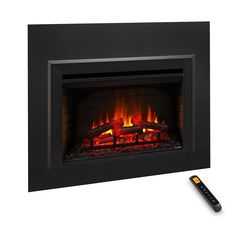 an electric fireplace with a remote control on the side and fire in the middle,