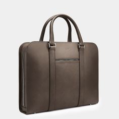 A contemporary case acting as personal portfolio; an everyday companion for the modern gentleman. Modern Case With Luggage Sleeve For Business Trips, Modern Briefcase For Business Trips, Modern Laptop Cases For Business Trips, Modern Briefcase With Luggage Sleeve For Work, Timeless Briefcase With Luggage Sleeve For Business Trips, Modern Leather Case For Business, Modern Leather Briefcase For Work, Modern Leather Briefcase For Workwear, Modern Leather Cases For Business