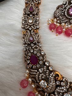 Victorian Mehndi Finish AD Polki Red Stone Pink Beads Long Statement Necklace with Matching Screwback EarringsColor : Victorian MehndiSize : Necklace Length : 24 Inches; Earring Length : 2 inches;Stones : AD Polki Red Stone Pink Beads Pearls