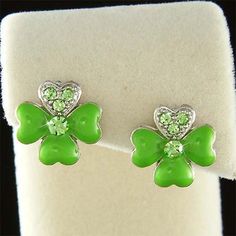 "PERFECT IRISH GIFT / WEDDING GIFT FOR LADIES /BRIDE/BRIDESMAIDS!! You are getting 1 pair of Green Enamel 4-Leaf Lucky Clover pierced earrings made with Swarovski Crystals. The earrings measure 9/16\" wide X 9/16\" high (14mm X 14mm). Crystal Color: Peridot Prices are in US$. For shipping policies and other important information, click on \"profile\" on the right. See an item that you like but has already been sold? Contact me to see if I have more! Thank you for stopping by Kashuen.com!" Bff Christmas Gifts, Bff Christmas, Vegan Jewelry, Lucky Shamrock, Irish Saints, Crystal Green, Irish Jewelry, Irish Gifts, Clover Earrings