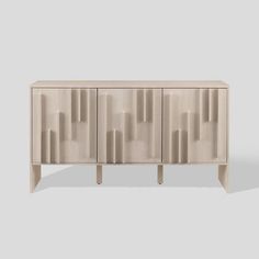 the sideboard is made out of wood and has an abstract design