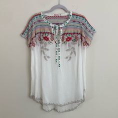 Johnny Was White With Colorful Embroidery Short Sleeves Too Like New- Short Sleeves 100% Cupra Rayon Size: L Length:31” Front/ 33” Back Width: 28” Bohemian Embroidered Top With Multicolor Geometric Patterns, Bohemian Embroidered Top With Multicolor Floral Embroidery, Bohemian Embroidered Top With Multicolor Floral Design, Bohemian Embroidered White Fabric For Spring, Bohemian Multicolor Embroidered Fabric For Spring, Multicolor Bohemian Embroidered Top With Border, Folk Style Multicolor Embroidered Top With Embroidered Hem, Bohemian Multicolor Embroidered Top, White Bohemian Top With Geometric Embroidery