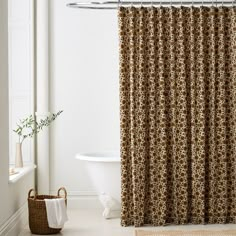 a bath room with a tub and a shower curtain