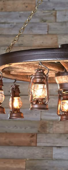 a chandelier made out of wood and hanging lights