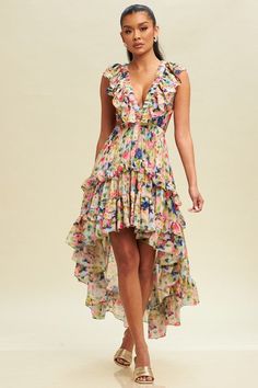 model is wearing Multi Dolce Vita Ruffle Dress  with gold heel sandals