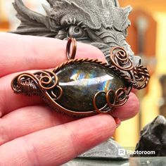 Discover The Mesmerizing Allure Of Our Handcrafted Dragon's Eye Pendant, Meticulously Wrapped In Oxidized Copper Wire And Adorned With A Stunning Labradorite Gemstone. This Piece Is Uniquely Crafted To Capture The Mythical Essence Of A Dragon's Eye, Creating A Spellbinding Focal Point That Draws Attention And Admiration. Labradorite Gemstone: Known For Its Iridescent Flashes Of Color, Labradorite Enhances The Mystical Aura Of This Pendant. As Light Hits The Stone From Different Angles, It Reveal Dragons Eye, Kitty Items, Dragon Scales, Oxidized Copper, Dragon Eye, Dragon Scale, Hello Kitty Items, Eye Pendant, Mens Accessories Jewelry