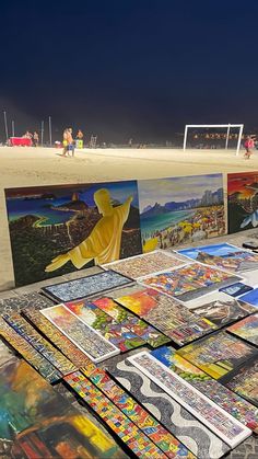 many paintings are on display at the beach