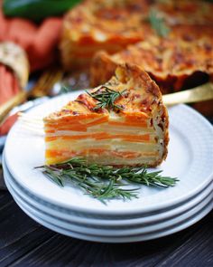 a piece of quiche on a plate with a fork