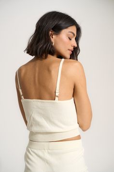 Made of 100% cotton, this wear-everyday tank is just the right blend of elevated and easy making it perfect for bedtime and beyond. Fitted Cotton Tops For Lounging, Comfortable Solid Seamless Tank Top, Spring Tops With Built-in Bra For Relaxation, Seamless Sleeveless Tops For Loungewear, Comfortable Seamless Solid Tank Top, Comfortable Seamless Tank Top, Comfortable Seamless Cotton Tops, Basic Cotton Tops With Built-in Bra, Cotton Tops With Built-in Bra For Daywear