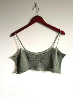 The knit sage coquette tank was handmade on the knitting machine. This piece is a beautiful piece that can be worn on a plain white t, over your cute bralette, or at the beach/River as a cover up. This price was machine knit by shop member Josie. Cropped Cotton Knit Top, Cropped Cotton Knit Top For Summer, Summer Cotton Knit Crop Top, Knit Scoop Neck Crop Top, Green Camisole Crop Top For Spring, Fitted Crop Top With Cropped Hem For Summer, Seamless Summer Knit Top, Fitted Summer Knit Tank Top, Seamless Knit Top For Summer