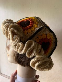 a crocheted hat is on top of a mannequin's head