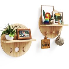 two wooden shelves with pictures and decorations on them