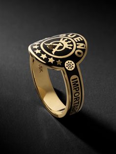 Foundrae uses an impressive technique called champlevé to craft this signet ring, it's fired until the 18-karat gold and vitreous enamel fuse, and then polished for a smooth finish. Designed to recall a cigar band, it features the word sueño , Spanish for 'dream', and bezel-set diamonds on either side of the crown. Luxury Black Enamel Signet Ring For Anniversary, Gold Diamond Jewelry With Intaglio, Luxury Black Enamel Signet Ring, Luxury Ceremonial Jewelry With Polished Finish, Ceremonial Luxury Jewelry With Polished Finish, Luxury Gold Enamel Ring For Ceremonial Occasions, Luxury Yellow Gold Signet Ring, Gold Luxury Ceremonial Enamel Ring, Luxury Gold Ceremonial Enamel Ring