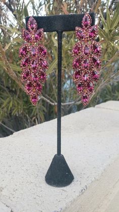 Pink Long Drop Earrings For Party, Pink Rhinestone Chandelier Earrings For Party, Pink Chandelier Earrings With Rhinestones For Party, Pink Party Chandelier Earrings With Rhinestones, Pink Crystal Chandelier Drop Earrings, Pink Crystal Chandelier Earrings, Glamorous Pink Rhinestone Crystal Earrings, Pink Crystal Earrings With Sparkling Stones For Evening, Pink Dangle Chandelier Earrings For Evening