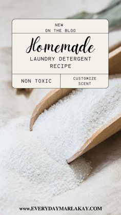 homemade laundry deterent recipe with wooden spoons and white powder in it on a bed