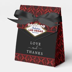 a red and black wedding gift bag with the las vegas love and thanks sign on it