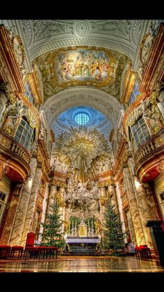 the inside of a church with paintings on the ceiling