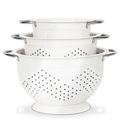 three white colanders stacked on top of each other