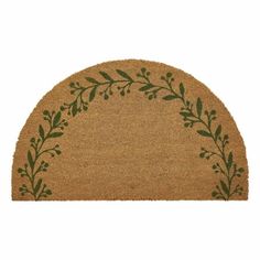 a brown door mat with green leaves on it