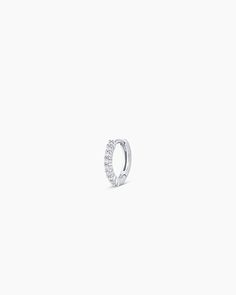 This diamond huggie earring is crafted from solid gold, making it a timeless and luxurious addition to any jewelry collection. Perfect for stacking or to wear alone, this diamond earring provides long-lasting shine. Wear yours stacked with other diamond huggie hoop earrings and studs. 14K White Gold Diamond Pavé Huggies Earring in 14k Solid White gold/Single, Women's by gorjana Silver Diamond Hoop Earrings With Single Diamond, Diamond White Diamond Huggie Single Earring, White Diamond Huggie Earring, White Gold Hoop Earrings With Diamond, White Gold Diamond Single Cartilage Earring, Silver Diamond Huggie Cartilage Earrings, Everyday White Gold Diamond Cartilage Earrings, Single Round Cut Cubic Zirconia Huggie Earring, White Gold Cubic Zirconia Huggie Cartilage Earrings