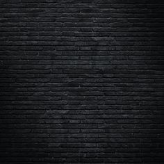 a black brick wall is shown in this image