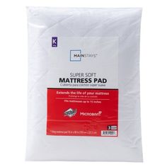 the white mattress pad is on display in front of a white background with red trim