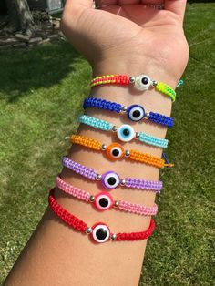 Adjustable evil eye bracelet. Available in 9 colors (price per bracelet) Adjustable Evil Eye Friendship Bracelets, Pink Adjustable Evil Eye Bracelet Trendy, Adjustable Pink Evil Eye Trendy Bracelet, Trendy Evil Eye Bracelet For Friendship, Casual Evil Eye Bracelets, Trendy Adjustable Evil Eye Friendship Bracelets, Adjustable Evil Eye Beaded Bracelets, Adjustable Round Evil Eye Bracelet, Multicolor Evil Eye Round Bracelets