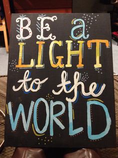 a sign that says, be a light to the world with colorful lettering on it