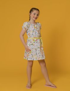 She'll love slipping into this playful A-line dress cut from 100% breathable cotton. It has an A-Line bodice, side pockets, wide round neck, puff-sleeve with elastic cuff and single button opening at the back.  Get free shipping when you spend $100 or more at www.raebenson.com 100 % Cotton Machine Wash Cold Imported Style G1104 Cotton Twirl Dress With Short Sleeves For Playwear, Fitted Short Sleeve Puff Sleeve Dress, Spring Short Sleeve Twirl Dress For Playdate, Casual Summer Twirl Dress For Playwear, Spring Short Sleeve Twirl Dress For Playwear, Casual Short Sleeve Summer Twirl Dress, Cute Printed Dresses For Playtime, Playful Floral Print Twirl Dress For Summer, Playful Summer Twirl Dress With Floral Print