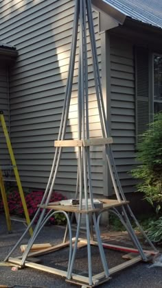 a wooden structure sitting in front of a house