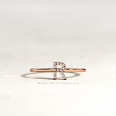 Letter Diamond Ring / Initial Diamond Ring / Personalized Diamond Ring / Personalized Ring / Dainty Initial Ring / Custom Initial Ring ▶ Watch Ring In 360o >> http://bit.ly/BN-202 ☆ Please write the letter you like on checkout ☆ ★ Details : ✔ Ring Width 1.3 mm ✔ Letter Size 5.8 mm ✔ Stones Natural Diamonds ✔ Total Carat Weight... Approx 0.05 Carats ✔ Diamonds Shape Round ✔ Diamonds Clarity SI ✔ Diamonds Color G ✔ Metal 14K / 18K Solid Gold ✔ Gold Color Yellow / White / Rose ✔ Ring US Size Luxury Classic Initial Ring With Diamond Accents, Diamond Promise Ring With Initials, Fine Jewelry Diamond Ring With Initials, Rose Gold Sterling Silver Rings With Initials, Fine Jewelry Diamond Ring With Initials For Gift, Alternative Images, Minimal Wedding Band, Minimal Engagement Ring, Quarter Ring