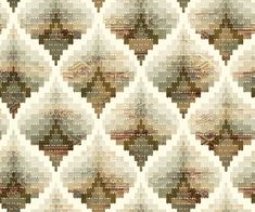 an abstract pattern with many different colors and patterns on it, including brown, beige, green