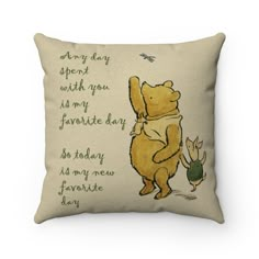 a winnie the pooh throw pillow with an image of a bear hugging a pig