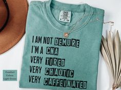 This funny t-shirt is perfect for medical professionals who are always keeping it together--even when everything's not! With the humorous phrase, it's a lighthearted way to bring some cheer to the chaos of the job. Wear it to spread smiles in the hospital or clinic! This classic unisex jersey short sleeve tee fits like a well-loved favorite. Soft cotton and quality print will make you fall in love with it over and over again. The relaxed fit keeps the wearer comfy in both casual and semi-formal Cna Shirts Ideas, Cna Outfits, Cna Quotes, Cna Aesthetic, Cna Shirts, Cna Nurse, Certified Nursing Assistant, Nursing Assistant, Nurse Appreciation