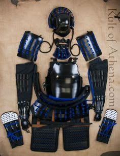 the blue and black motorcycle armor is laid out