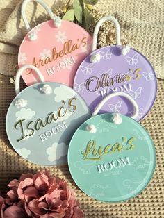 four personalized luggage tags with flowers in the background