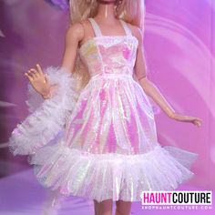 The girls are styling now at Haunt Couture! This look is out of this world. This Crystal party dress is made from a vintage style fabric with tulle accents. A matching boa is included to complete this look. outfits are MADE TO ORDER and ship 3 weeks from purchase.  Dress and boa only. Accessories and dolls not included. NO DOLL OR SHOES. ONLY ITEMS STATED. PLEASE READ. Glamorous Carnival Costume Party Dresses, Princess Style Summer Fairy Dress For Party, Summer Party Princess Fairy Dress, Princess Style Fairy Dress For Summer Party, Carnival Fitted Dress With Ruffles, Fitted Whimsical Fairy Dress For Party, Whimsical Fitted Fairy Dress For Party, Pink Fitted Fairy Dress For Parties, Carnival Party Dress With Ruffles