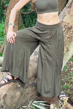 Long flowy Persephone Palazzo Pants come in one size, fits sizes 0-14. Soft stretchy viscose waist band can be worn high or folded over. Pull string around hips created snug fit for smaller body sizes. Available in Onyx, Sage and Rust. Ethically handmade of tree pulp eco Lyocell fabric its silky, luxurious and stunning, also known as vegan silk. Matching Bell Sleeve Lily Tops, Halter Tops, and Tube Tops make gorgeous eco outfits. Mix and match styles and colors. Persephone Pants, Lyocell Fabric, Large Clothes, Tube Tops, Flowy Pants, Halter Tops, Swaggy Outfits, Street Outfit, Matching Top