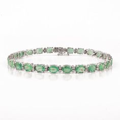 This is a classic style tennis bracelet. A must-have statement piece for every woman. It's a classic luxury to have. A perfect gift for your loved ones.-Material - Solid 18K White Gold -Gemstone -  Guanine Emeralds & Diamonds-Gemstone Weight - 8.070 ct-Diamond Weight - 0.410 ct-Gross weight - 8.75 gramsYou can also go to my shop Home for more similar bracelets: https://www.etsy.com/in-en/shop/Silver AppealWe offer free resizing, and any customization is welcome.A satisfied customer is our to Classic Gemstone Bracelet For Anniversary, Classic Gemstone Bracelets For Anniversary, Classic Anniversary Bracelet With Gemstone, Classic Gemstone Tennis Bracelet For Anniversary, Classic Green Tennis Bracelet For Formal Occasions, Green Classic Tennis Bracelet For Formal Occasions, Classic Green Tennis Bracelet For Anniversary, Classic Green Jubilee Bracelet, Classic Green Oval Tennis Bracelet