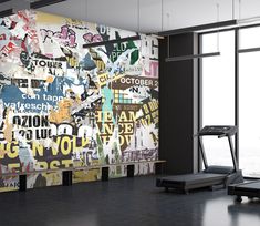 there is a gym room with a large mural on the wall and a treadmill in front of it