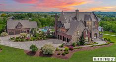 an aerial view of a large home in the countryside