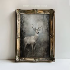 a painting of a deer in a gold frame