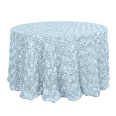 a round table cloth with white swirls on the top and blue fabric around it