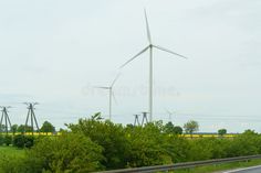 Landscape from renewable energy wind turbine with field, forest and sky stock photos Sky Landscape, Renewable Energy, Wind Turbine, Energy