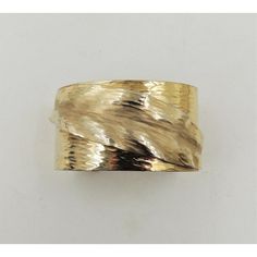 This is part of Chairish’s Costume Jewelry assortment.  Hammered goldtone cuff bracelet with "frosted" leaf on it. Marked "Napier." Dates to 1981. An identical bracelet is shown on pg. 547 of Melinda L. Lewis & Henry Swen's book "The Napier Co.: Defining 20th Century American Costume Jewelry." Opening in bracelet; 1 1/8 inches with a little bit of flexibility. Interior circumference; 6 3/4 inches. Overall measures: 2.5 inches wide by 1.88 inches deep by 1.88 inches high. Condition: Very good; Mi American Costume, Book Pieces, Modern Branding, Costume Jewelry, Cuff Bracelet, 20th Century, Cuff Bracelets, Dates, Gold Tones