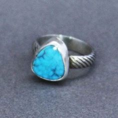 A beautiful blue Morenci Turquoise cabochon has been set in sterling silver on a textured silver band. The ring is hand-fabricated. Approximate size 7 3/4. Artisan Turquoise Ring Stamped 925, Blue Turquoise Ring In Sterling Silver, Sterling Silver Turquoise Ring Stamped 925, Blue Turquoise Ring In Sterling Silver Stamped 925, Blue Turquoise Sterling Silver Ring Stamped 925, Artisan Blue Turquoise Ring Stamped 925, Turquoise Sterling Silver Ring Stamped 925, Artisan Blue Ring Stamped 925, Blue Hand Forged Rings For Anniversary