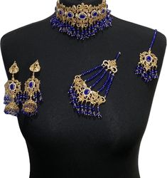 bridal jewellery set. Set includes- Necklace  Earrings  Jhumar  Tikka Elegant Blue Kundan Necklace With Intricate Design, Bollywood Blue Bridal Necklace Hand Set, Blue Hand Set Jewelry Sets For Wedding, Hand Set Blue Jewelry Sets For Wedding, Blue Hand Set Jewelry For Wedding, Wedding Blue Hand Set Jewelry Sets, Elegant Blue Bridal Necklace With Intricate Design, Blue Kundan Necklace For Reception Festivities, Blue Kundan Necklace For Reception And Festive Occasions