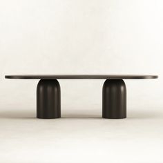 the table is made out of metal and has two round bases on each end,