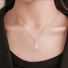 "The Infinity cremation necklace is a beautiful and elegant way to memorialize your loved one. Made of high-grade stainless steel and featuring a delicate polished sheen, it has a contemporary yet truly timeless look. The pendant has a threaded screw on the bottom which opens to a small compartment that can only hold a minimal amount of ashes. To ensure security of ashes, we recommend adding a dab of super glue to the screw enclosure after inserted the ashes into the pendant. ∞ To fill the urn n Elegant Hypoallergenic Stainless Steel Necklaces, Elegant White Necklace For Memorials, Elegant Hypoallergenic Stainless Steel Necklace, Elegant Hypoallergenic Jewelry For Memorials, Elegant Hypoallergenic Jewelry For Memorial, Elegant Stainless Steel Birthstone Necklaces, Elegant Stainless Steel Birthstone Necklace, Silver Teardrop Pendant Necklace Gift For Mom, Silver Teardrop Pendant Necklace As Gift For Mom